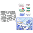 Metal dies with tea-themed designs and a decorative card on a white background