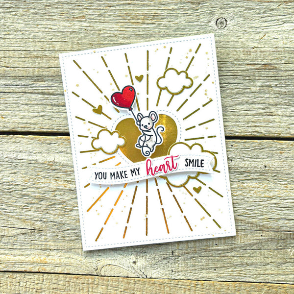 Card with heart and mouse design on a wooden surface