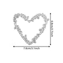 Heart-shaped metal cutting die with dimensions indicated on a white background