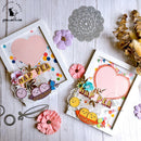 Two handmade cards with decorative elements on a wooden surface.