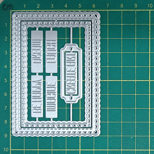 Metal die cutters with decorative edges on a green cutting mat