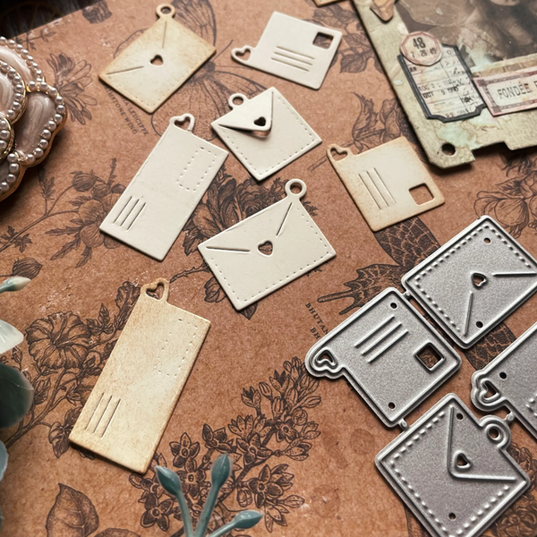 Decorative metal tags on a textured surface with floral designs
