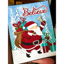Christmas card with Santa Claus holding a bell and presents, set against a snowy background with the word 'Believe'.