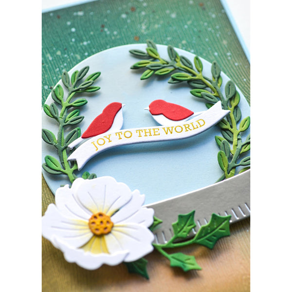 Decorative card with birds, flowers, and 'Joy to the World' text on a green background.