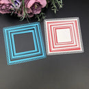 Two square cutout shapes, one blue and one red with white lace trim, on a dark surface with flowers in the background.