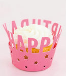 Cupcake in a pink wrapper with 'Happy' text on a light pink background