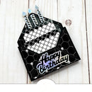 Black and white birthday card with 'Happy Birthday' text on a wooden surface