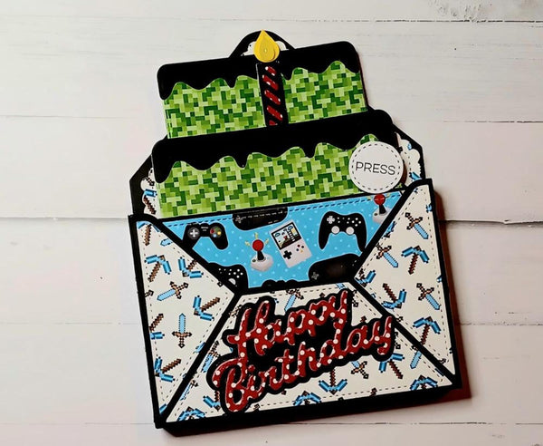 Greeting card with pixelated design and 'Happy Birthday' text on a white wooden background