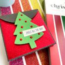 Handmade Christmas card with green tree design and 'Jingle All the Way' text on a red background.