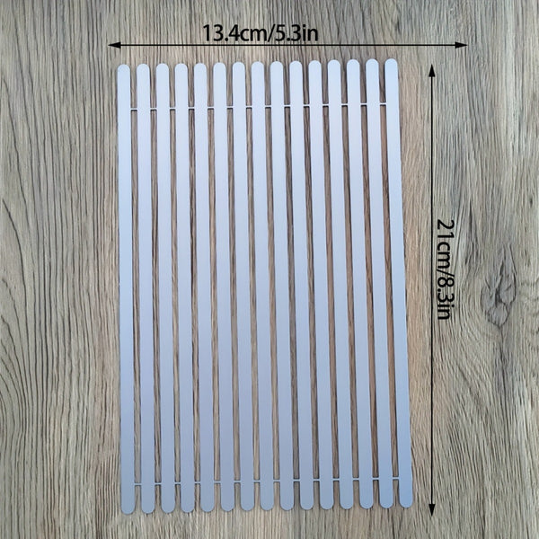 Rectangular white mat with dimensions on a wooden surface