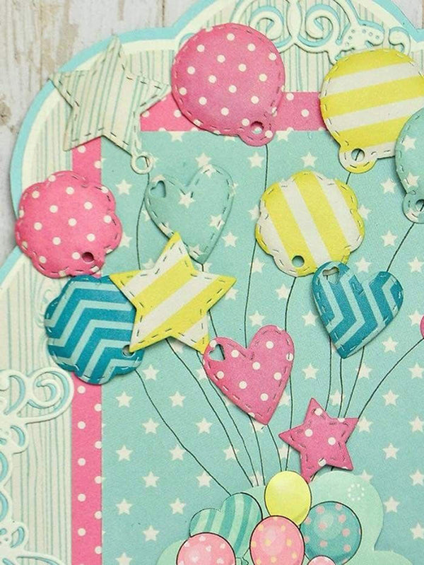 Colorful paper balloons on a light blue background with star and heart shapes.
