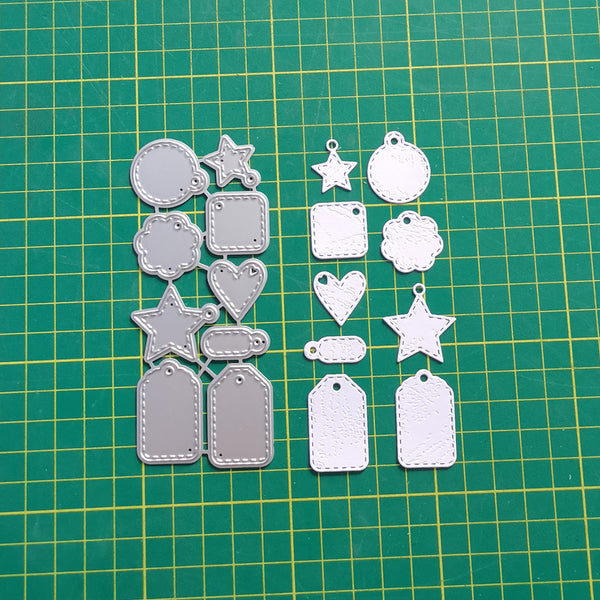 Set of metal die-cut shapes on a green cutting mat