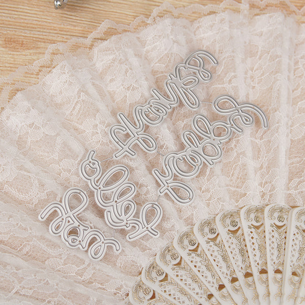 Decorative metal word cutouts on a textured fabric background
