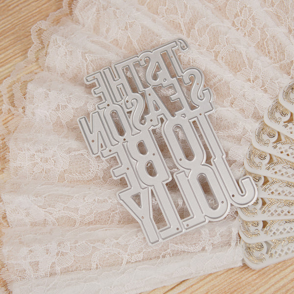 Metal word die cutters on a lace background