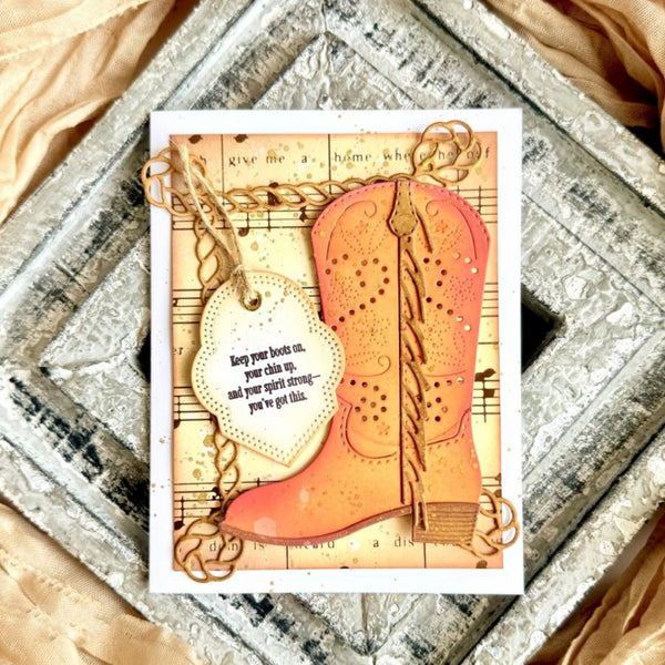 Card with a pink boot design and motivational text on a decorative background