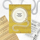 Decorative card with music sheet design and motivational quote on a textured surface.