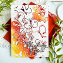 Greeting card with butterfly design and 'Thinking of You' text, surrounded by decorative elements.