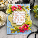 Decorative card with floral designs and inspirational text on a textured surface.