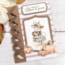 Greeting card with a rabbit and pumpkins design on a wooden surface