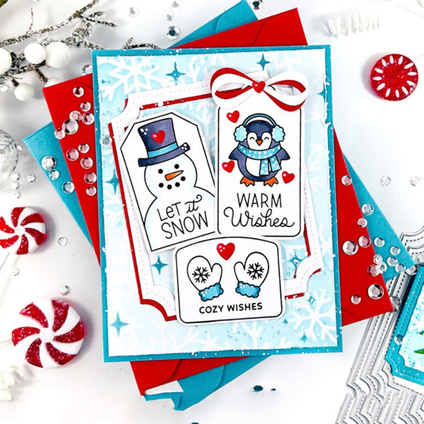 Christmas-themed card with snowman, penguin, and text on a decorative background.