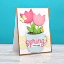 Card with pink tulips in a mug labeled 'spring greetings' on a blue background