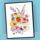 Framed artwork with colorful flowers and a butterfly on a blue background