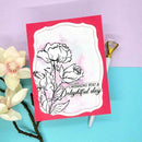 Greeting card with floral design and 'Wishing you a delightful day' text on a colorful background