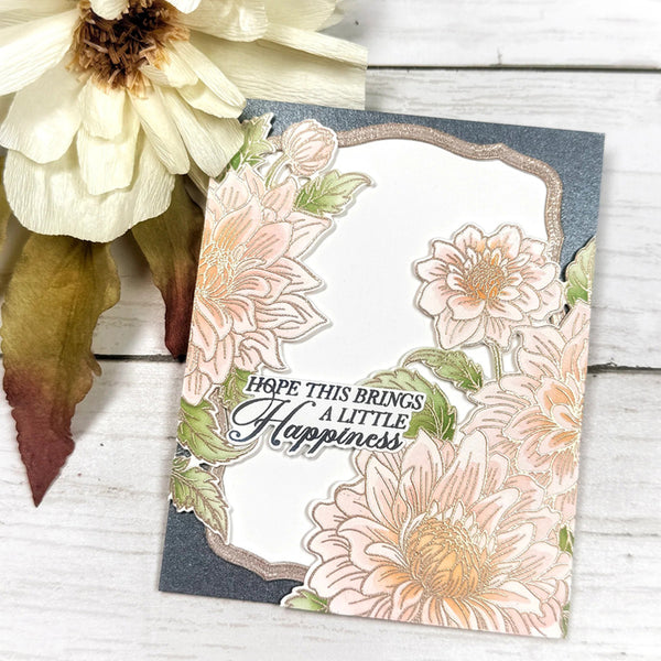 Floral card with text 'Hope this brings a little happiness' on a wooden surface with flowers.