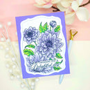 Floral card with 'Wishing you a delightful day' text on a pink background with flowers.