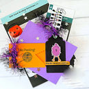 Halloween-themed gift card and envelope set with decorative elements on a white background