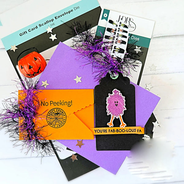 Halloween-themed gift card and envelope set with decorative elements on a white background