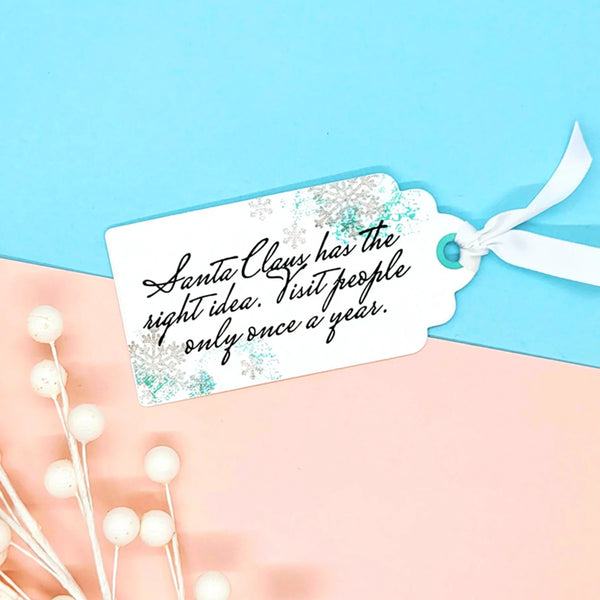 Gift tag with humorous text on a light blue and pink background