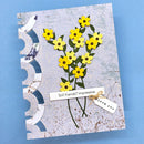 Greeting card with yellow flowers and text on a blue background