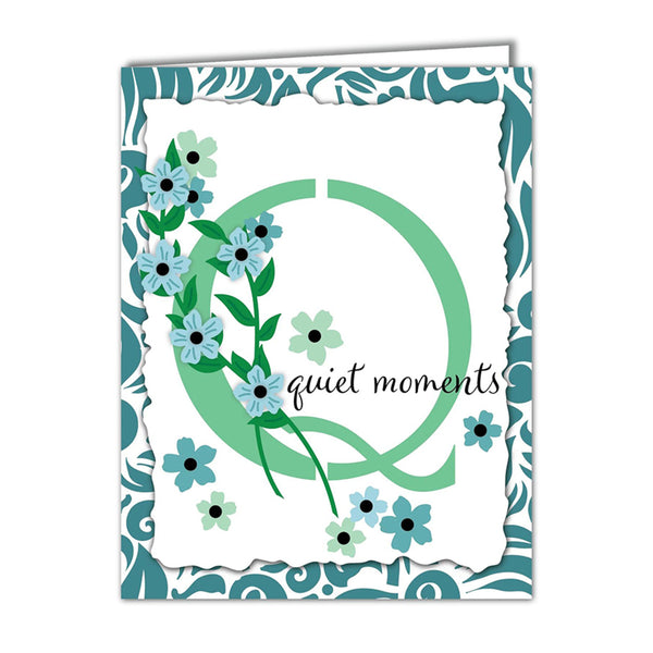Greeting card with floral design and 'quiet moments' text on a decorative border
