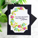 Greeting card with floral design and text 'You make the world feel like home' on a black background.