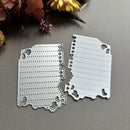 Two metal cutting dies on a gray surface with flowers in the background