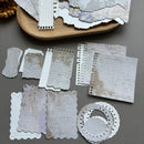 Collection of decorative paper pieces on a gray surface