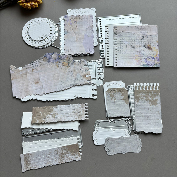 Collection of decorative paper pieces on a gray surface