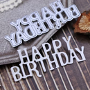 Metallic 'Happy Birthday' letter cutouts on a wooden surface