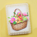 Decorative card with a wicker basket and flowers on a yellow background