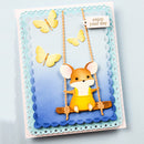 Card with a cute illustration of a mouse on a swing, surrounded by butterflies and text 'enjoy your day'.
