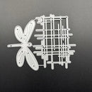 Metal cutting dies in the shapes of a dragonfly and a grid on a dark background