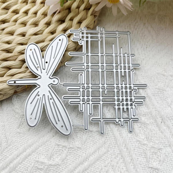 Metal cutting dies with butterfly and grid design on a textured surface.