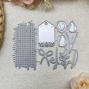 Set of metal dies with various shapes on a textured surface with flowers and roses.