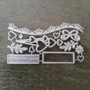 Metal die cut with decorative elements on a textured surface