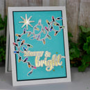 Greeting card with Christmas lights and 'Merry & Bright' text on a blue background