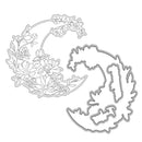 Metal die cut with floral design on a white background