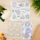 Set of stamps and dies on a wooden surface with decorative elements.