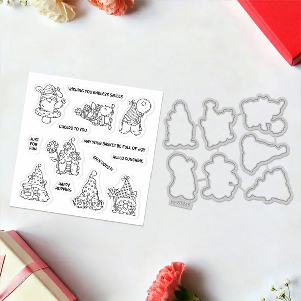 Metal die cut shapes of Christmas-themed figures on a white surface with printed sentiments.