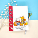 Card with cartoon foxes and mouse holding hands, text 'You make the world feel like home', on a blue and beige background.